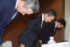 金融機関に出向した社員が無断で内部情報を持ち出していた問題で、会見冒頭に頭を下げる日本生命の赤堀直樹副社長（中央）ら＝１２日午後、東京都千代田区