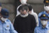 再逮捕された銭凌容疑者（中央）＝１６日午前、東京都江東区