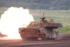 陸上自衛隊の実弾演習で、主砲を放つ１０式戦車＝６月８日、静岡県の東富士演習場