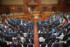 憲法改正の手続きを定めた国民投票法の改正案が可決された衆院本会議=19日午後、国会内